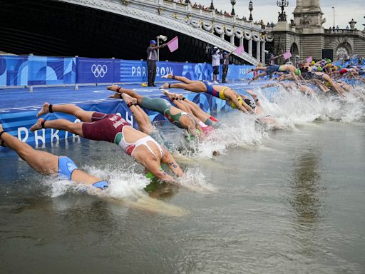 Olympic triathletes swim in Seine River after days of concerns about water quality