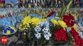A precious moment in time of war: Flowers for a wife and daughter coming home to Ukraine - Times of India