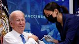 Biden gets new COVID vaccine, announces new virus initiatives