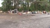 Business owners say illegal dumping making busy shopping center parking lot look like ‘junkyard’
