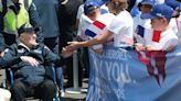 French children hail D-Day vets as heroes as they arrive in Normandy for 80th anniversary