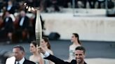 Olympic flame passed to Paris 2024 delegation during handover ceremony in Athens