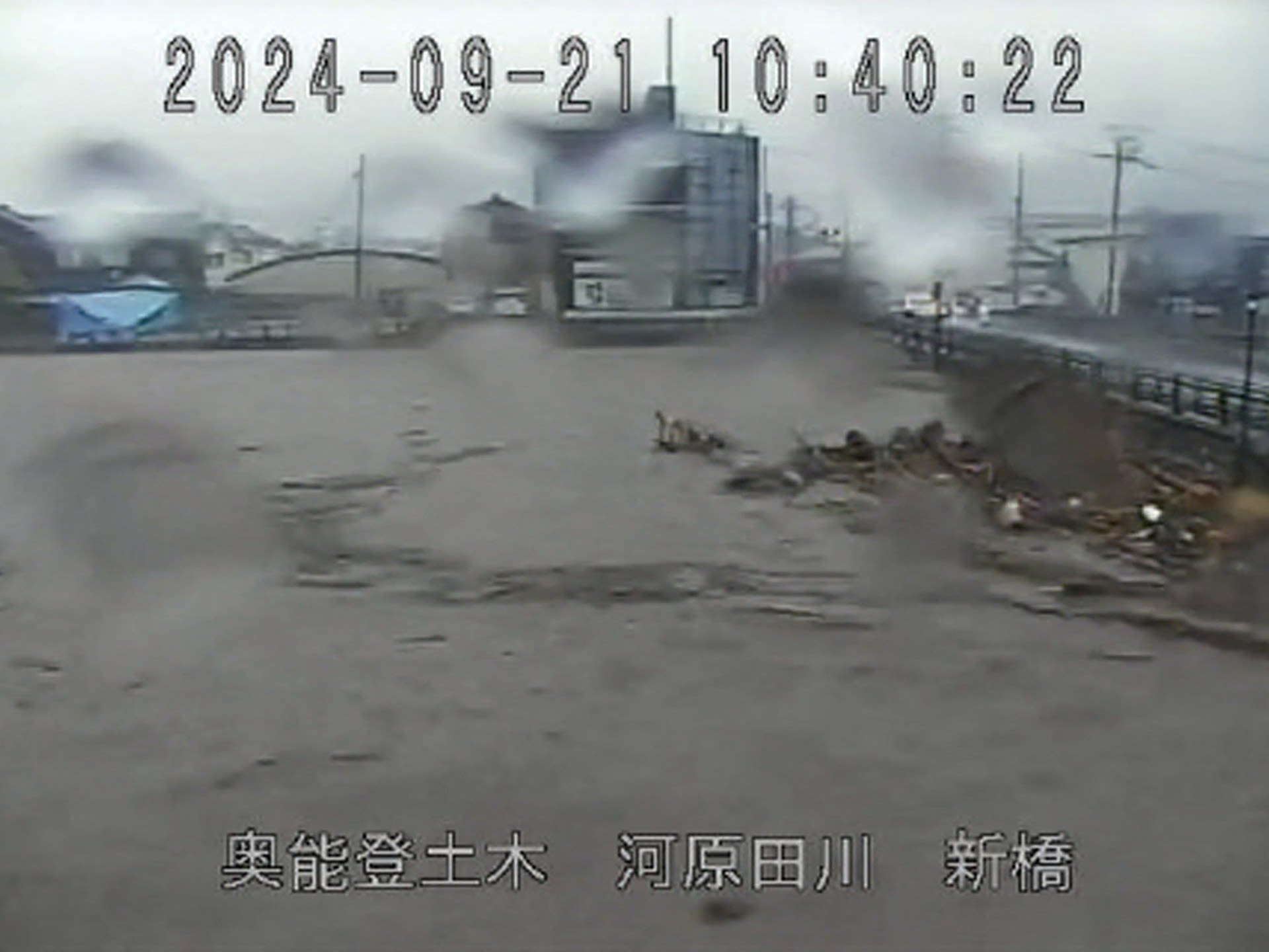 Japan orders thousands to evacuate quake-hit region as rains trigger floods