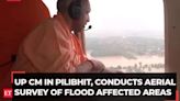 UP: CM Yogi conducts aerial survey of flood affected areas in Pilibhit; meets affected people