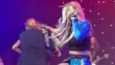 Ava Max slapped in face and scratched in the eye by man who runs on stage during her LA show