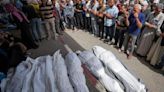 An airstrike kills 20 in central Gaza and fighting rages as Israel's leaders air wartime divisions