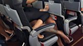 Passenger Calls Out Couple Cuddling on Airplane in Photo, Exposing Bare Feet in the Aisle: 'My View'