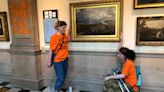 Climate protesters glue themselves to frame of artwork at Kelvingrove museum