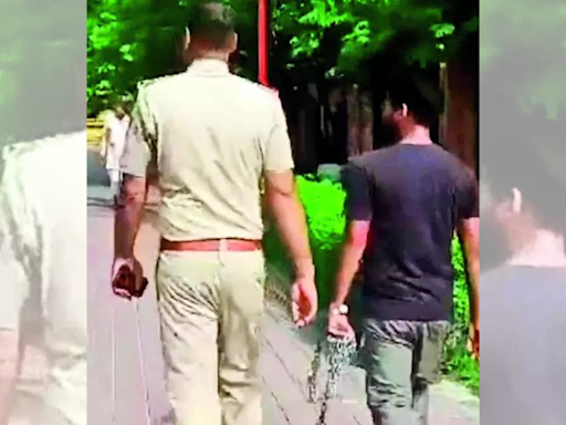 Chain reaction: Cops take man in chains for tour of Taj Mahal, face action | India News - Times of India