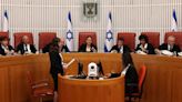 Israel’s top court strikes down key part of judicial overhaul, reigniting divisions as war rages