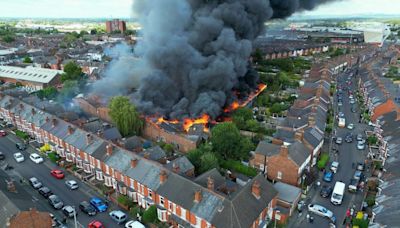 Enormous fire hits town as residents evacuated and 15 fire engines rush to scene