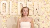 Gillian Anderson’s Silver Aquazzura Handbag Shined at the Golden Globes