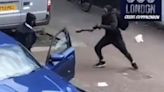 Thugs armed with Rambo knives fight in the middle of London street