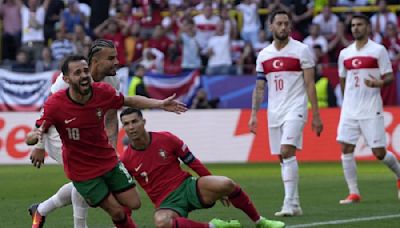 European Championship: Portugal seal passage to knockouts in style