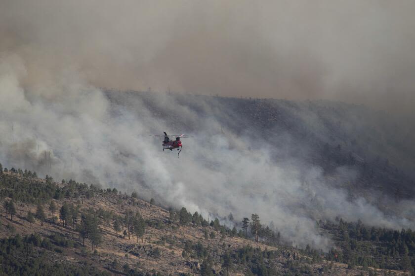 Two fires, fueled by heat and dry winds, inch toward communities in Sierra and Fresno counties