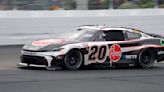 Christopher Bell takes the checkered flag on rain tires in the NASCAR Cup race at New Hampshire