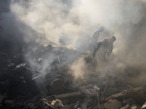 Israel's deadliest strike in central Beirut leaves Lebanese stunned as they dig through the rubble