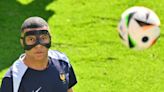 France fans don creative masks in tribute to Kylian Mbappé