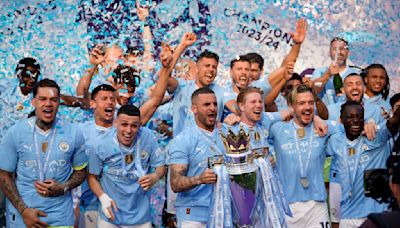 Man City fans party as Guardiola's dominant team wins a record fourth straight Premier League title