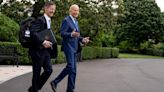 U.S. President Joe Biden accompanied by Deputy Chief of Staff Bruce Reed, left, reacts to reporter's shouted questions as he walks to Marine One on the South Lawn of the White House on...