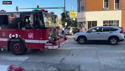 SUV hits car, restaurant on Chicago's North Side after running red light, police say