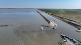 California, facing another wet winter, races to prevent more flooding with levee repairs