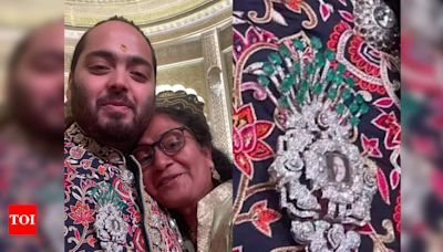 Anant Ambani wore a brooch with Dhirubhai Ambani's picture at his wedding reception - Times of India