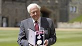 Sir David Attenborough beams as he collects high honour from Prince of Wales