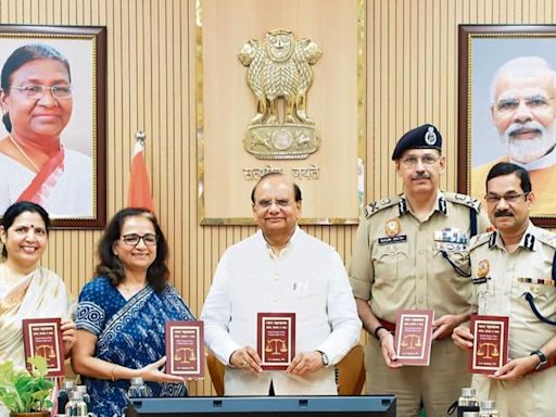 IPS Sunil Kumar Gautam presents his new book to LG Delhi Vinay Kumar Saxena