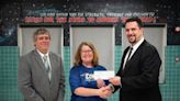 Huntsville Law Firm pays off student lunch debt at Madison Cross Roads Elementary School