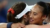 All over: Zheng Qinwen embraces Alize Cornet after ending the Frenchwoman's career on Tuesday