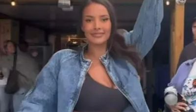 Maya Jama shows off her toned abs in a crop top as she dances with pals