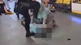 Moment armed policeman stamps on suspect's head during violent arrest
