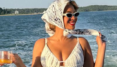 Beyonce shows off cleavage in mini-dress as she kicks back on luxury boat trip