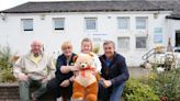 Little girl wins a teddy bear in raffle to boost community garden