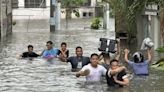 A typhoon kills 3 as it nears Taiwan. It killed 13 in the Philippines, where people plead for rescue