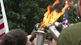 Law enforcement officers carry the flame of hope to the Capital City