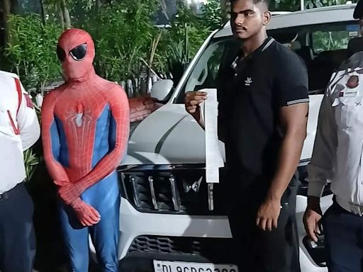 Delhi Police Arrest 'Spider Man' found riding on car bonnet in Dwarka - The Economic Times