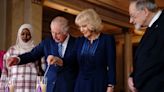 King and Queen Consort light candles to remember horrors of the Holocaust