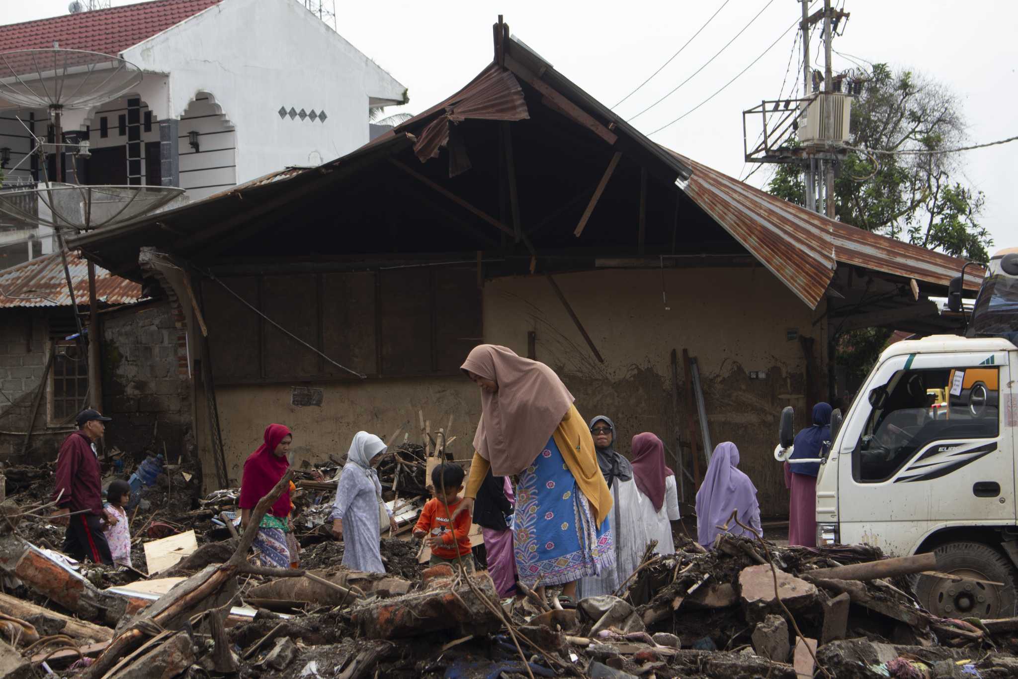 Indonesia seeds clouds to block rainfall after floods killed at least 59 people while 16 are missing