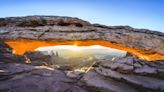 Mesa Arch is one of the most spectacular spots in Canyonlands National Park – and tourists are climbing all over it