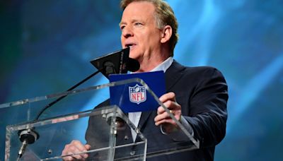 Why do fans boo NFL commissioner Roger Goodell during the NFL Draft?