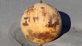 A mysterious iron ball washed up on a beach in Japan. What could it be?