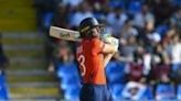 On the attack: England captain Jos Buttler hits a six during an eight-wicket rout of Oman in the T20 World Cup in Antigua