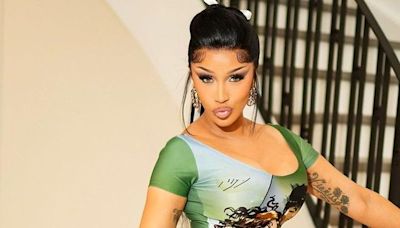 Cardi B’s preppy grunge look’s colour palette matches her thigh tattoo