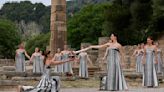 Despite weather glitch, the Paris Olympics flame is lit at the Greek cradle of ancient games