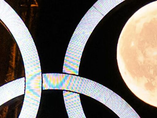 Eiffel Tower And Moon Put On Olympically Spectacular Display Ahead Of Games