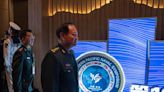 Chinese general takes a harsh line on Taiwan and other disputes at an international naval gathering