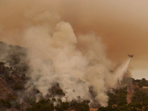 Torrid heat bakes millions of people in large swaths of U.S., setting records and fanning wildfires