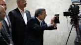 Iran’s ex-president Ahmadinejad, disqualified Larijani sign up for election